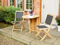 Klappstuhl Fairchild Teak Textilene® Schwarz -Gartenmöbel Verkäufe teakholz textilene klappstuhl fairchild ambientebild 4 627x627